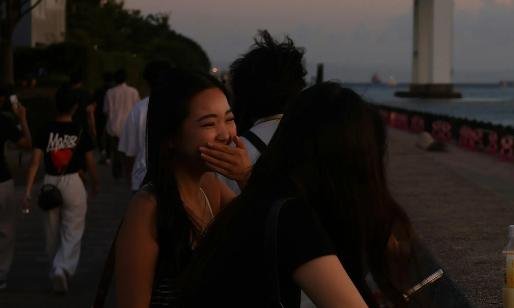 Friends laughing together in the evening light